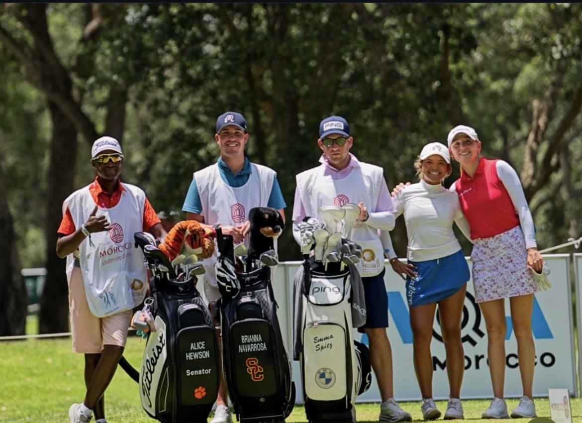 LET caddie and player walking the fairway